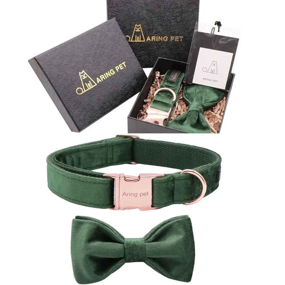 Luxurious emerald green velvet dog collar with rose gold buckle and matching bow tie accessory, displayed with elegant black gift box packaging"
