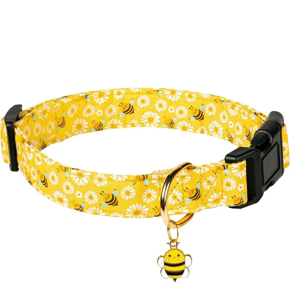 "Bright yellow dog collar with white daisy flowers and cute bumblebee pattern, featuring black quick-release buckle and gold D-ring with bee charm pendant"